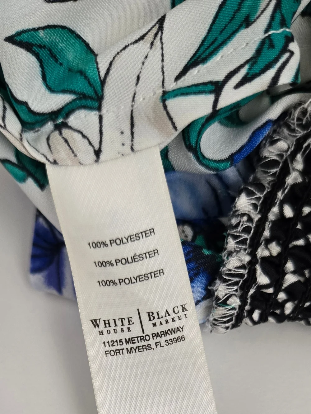 Floral Sleeveless Top With Ruched Band At Bottom In White and Blue. - Picture 3 of 3